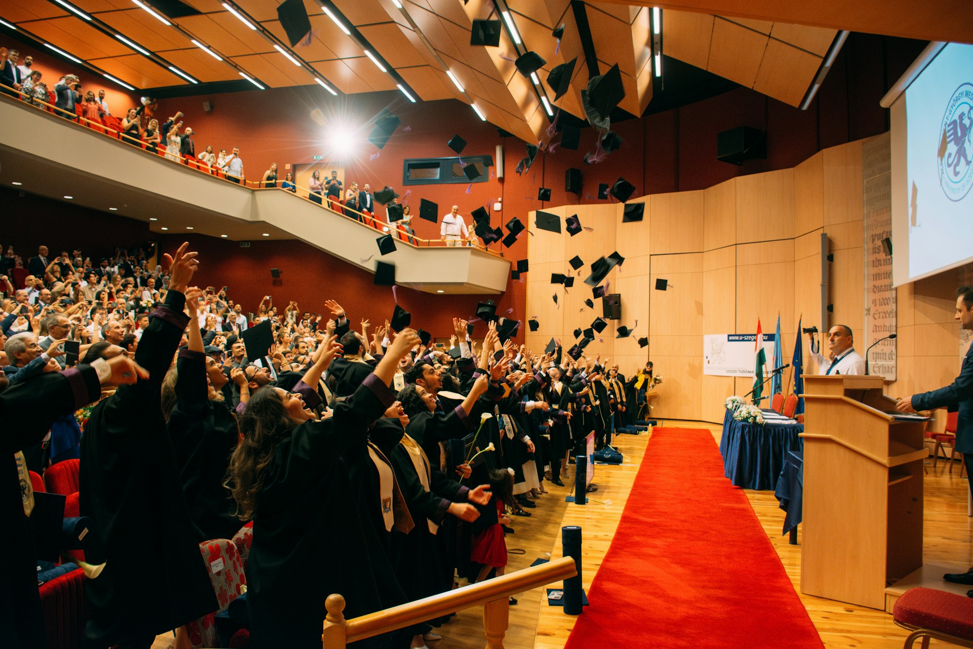 A man standing at a podium in front of a crowd of people